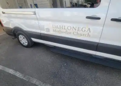Decal on the right side of the Dahlonega Methodist Church Van on the door