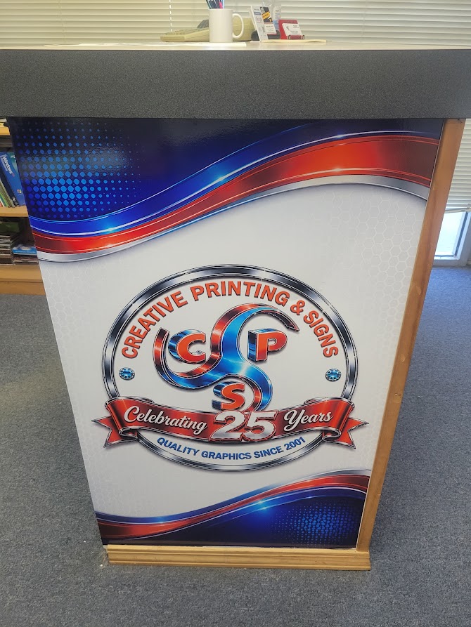 Front Desk Side Head On Creative Printing and signs vinyl wrap for the side of front desk